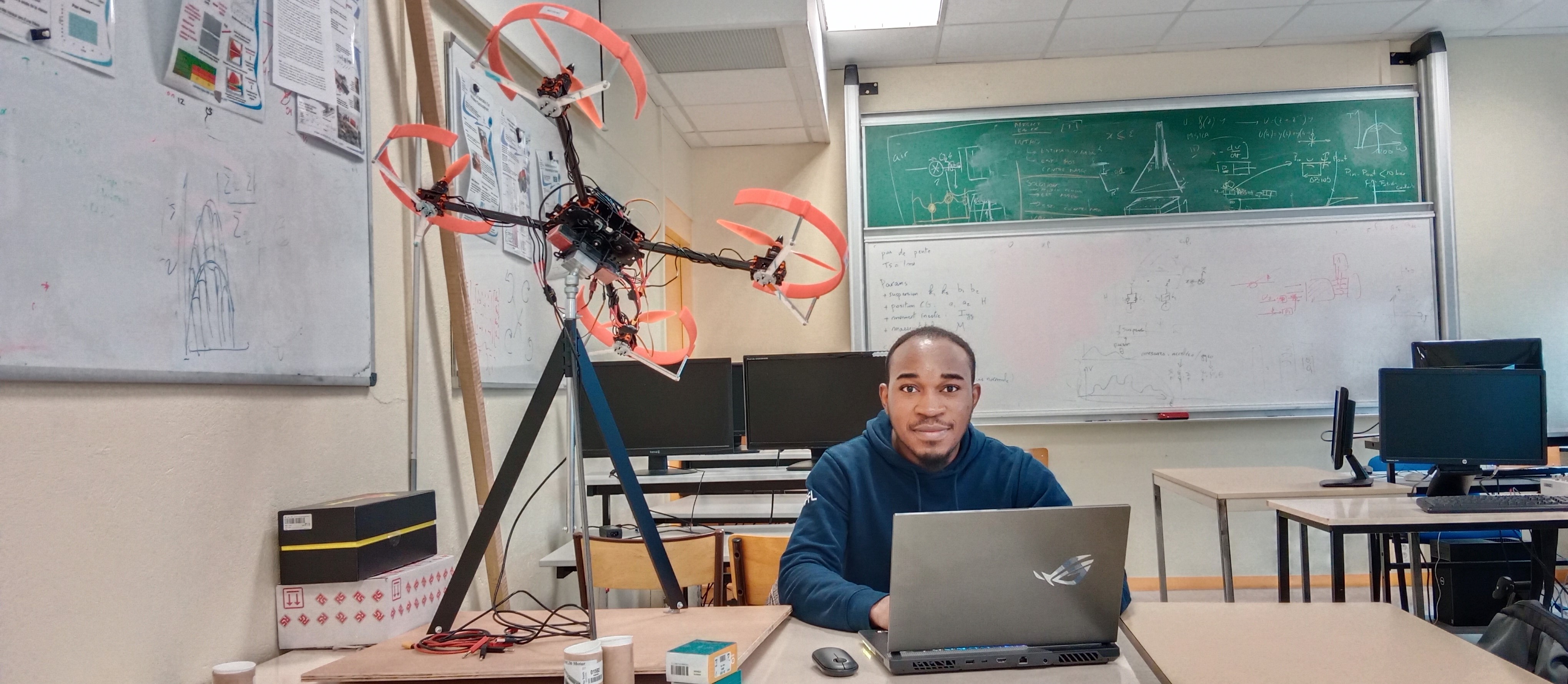 Experimental quadcopter testbed in a laboratory setting.